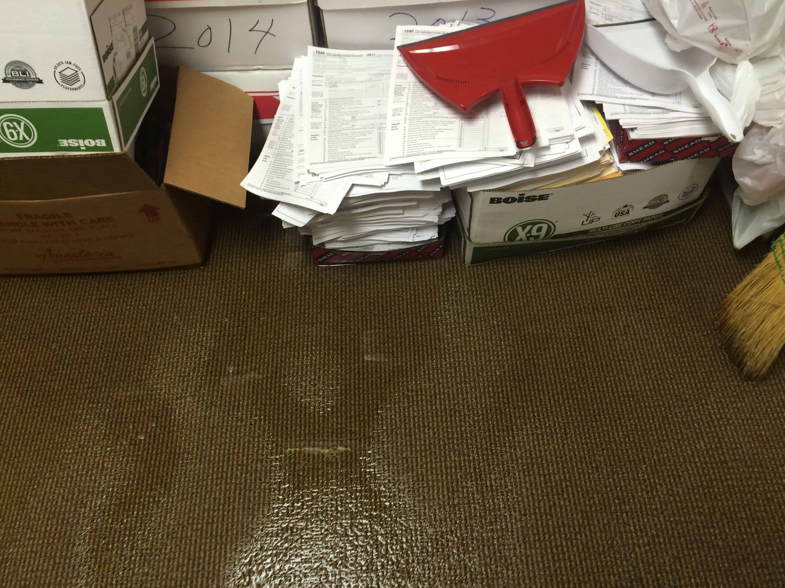 important documents on the floor in a box surrounded by water