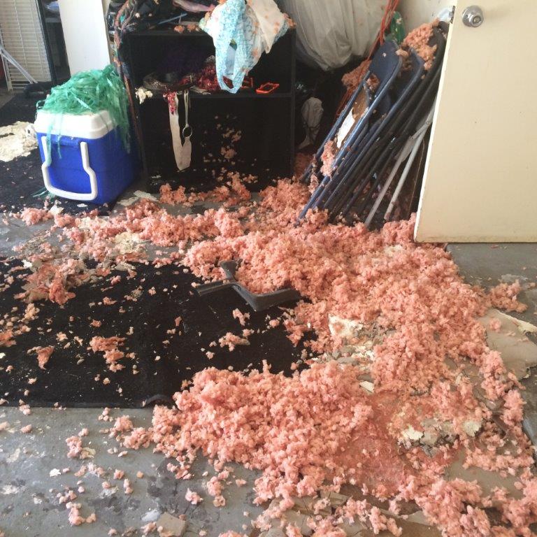water damage affects homes ceiling collapsed insulation on the floor